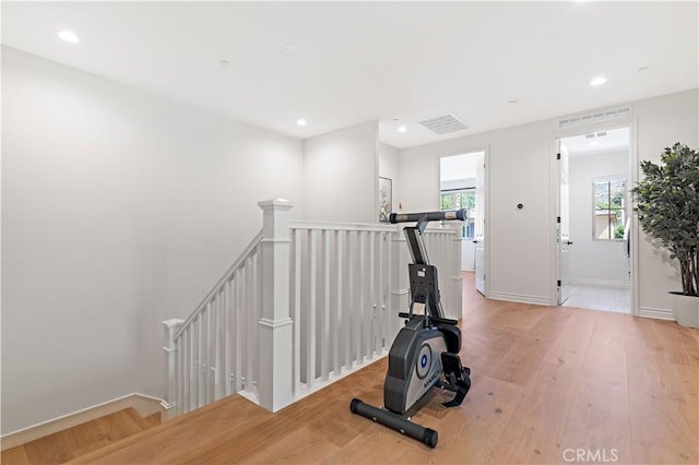 workout area with light wood-type flooring