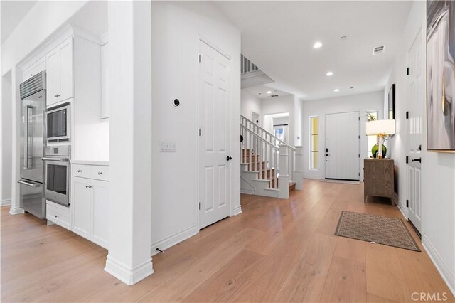 entrance foyer with light wood-type flooring