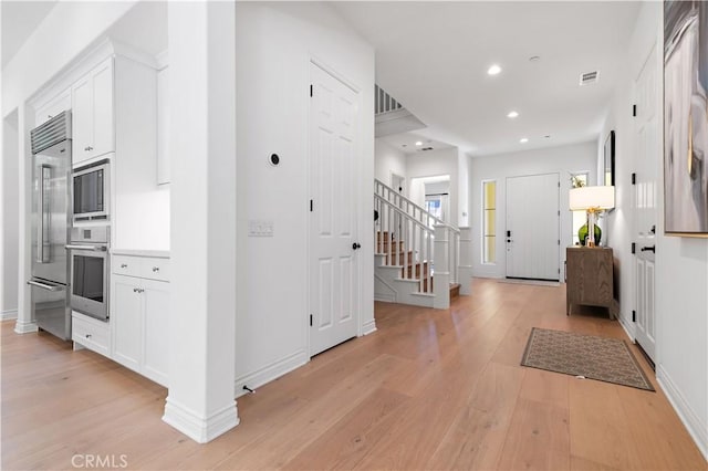 66 Poncho, Irvine, CA 92602 - entrance foyer with light wood-style floors, stairs, recessed lighting, and baseboards