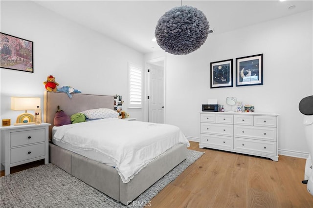 bedroom with light wood-type flooring