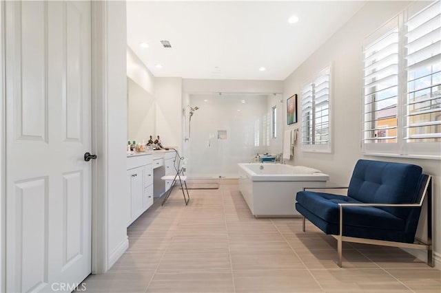 66 Poncho, Irvine, CA 92602 - bathroom with a stall shower, vanity, a soaking tub, tile patterned floors, and recessed lighting