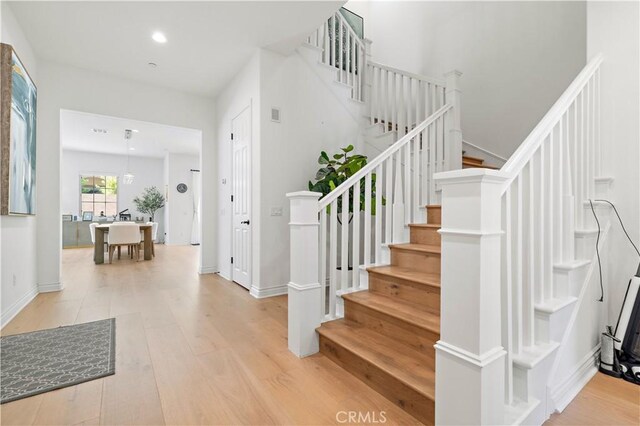 stairway featuring hardwood / wood-style flooring