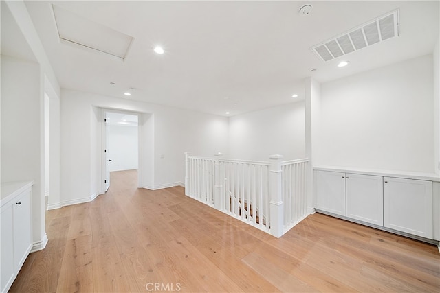 66 Poncho, Irvine, CA 92602 - hallway with an upstairs landing, light wood-type flooring, attic access, and recessed lighting