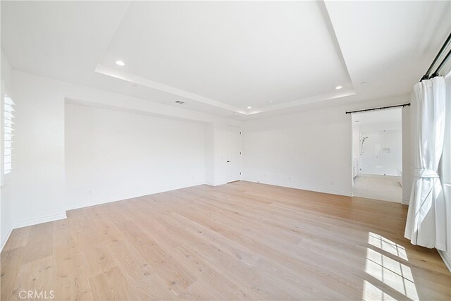 66 Poncho, Irvine, CA 92602 - spare room with a raised ceiling, recessed lighting, and light wood-style floors