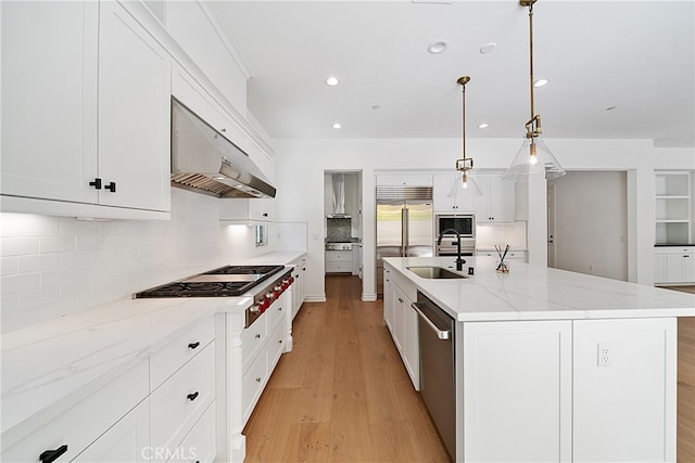66 Poncho, Irvine, CA 92602 - kitchen featuring under cabinet range hood, stainless steel appliances, light wood-style flooring, backsplash, and white cabinets