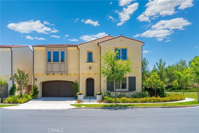 66 Poncho, Irvine, CA 92602 - mediterranean / spanish-style house with stucco siding, concrete driveway, and a garage