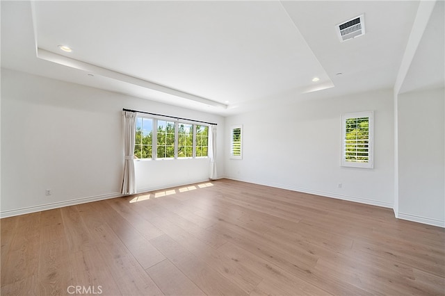 66 Poncho, Irvine, CA 92602 - empty room featuring a raised ceiling, light wood-style flooring, and recessed lighting