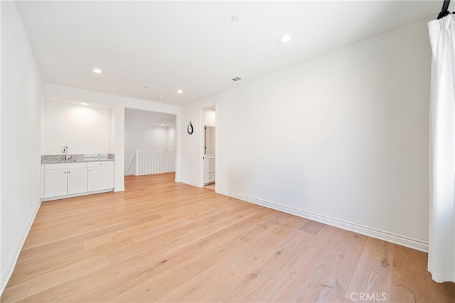 66 Poncho, Irvine, CA 92602 - empty room with light wood-style flooring and recessed lighting