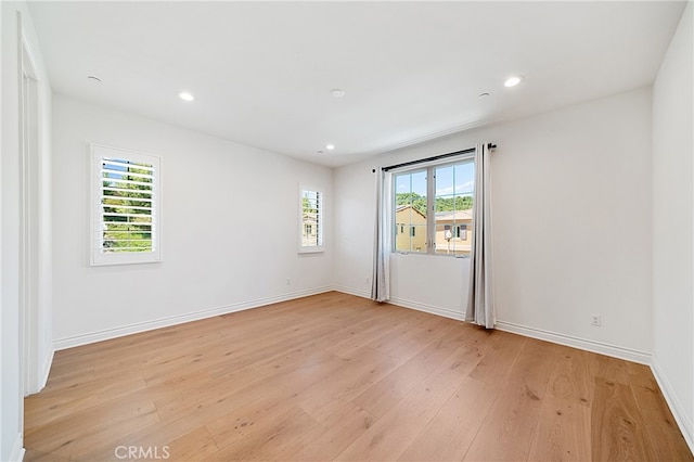 66 Poncho, Irvine, CA 92602 - empty room with light wood-style floors and recessed lighting
