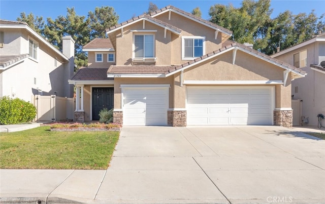 view of front of home with a front lawn and a garage