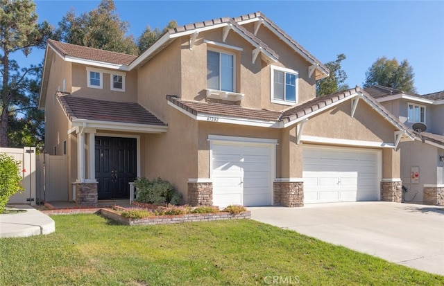 craftsman-style home featuring a front lawn and a garage