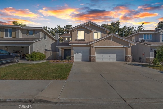 craftsman-style home with a yard and a garage