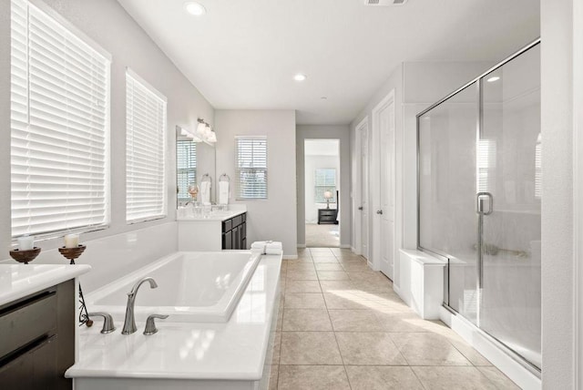 bathroom featuring vanity, tile patterned floors, and separate shower and tub