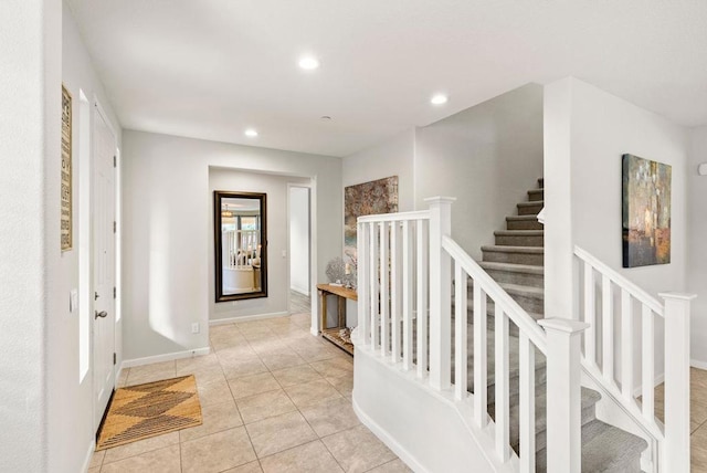 foyer entrance featuring light tile patterned flooring