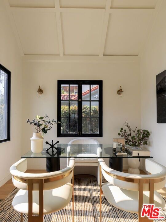 interior space with plenty of natural light and coffered ceiling