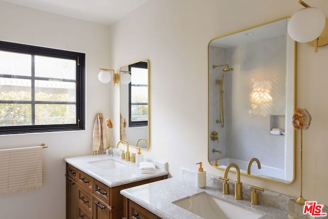 bathroom featuring vanity and bathing tub / shower combination