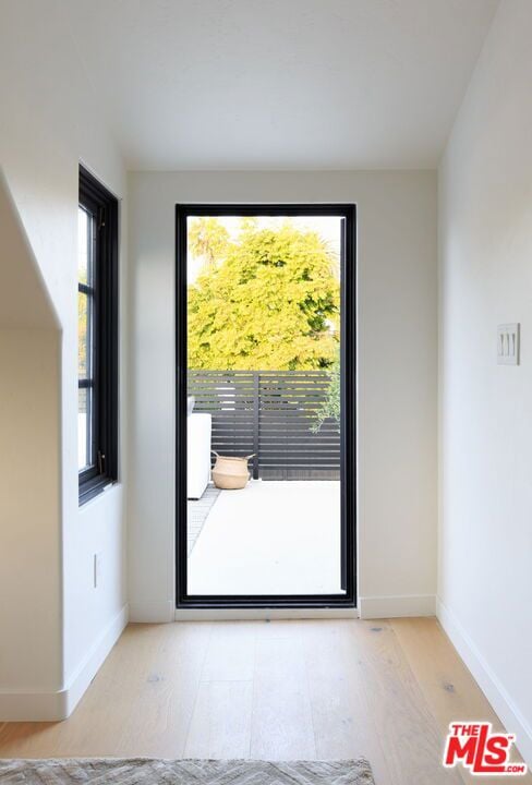 doorway to outside featuring light hardwood / wood-style floors