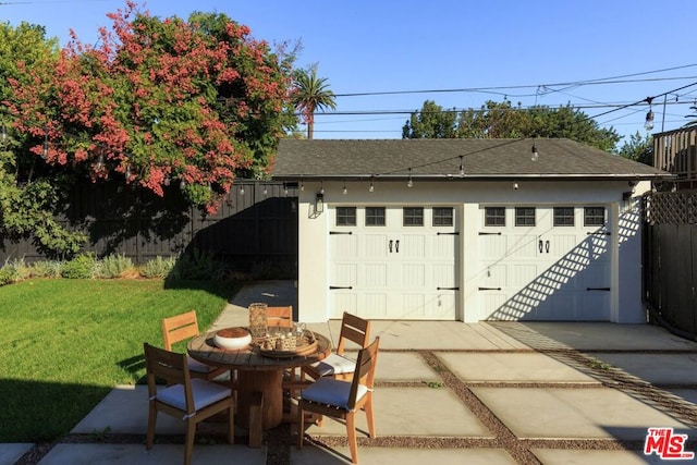 garage featuring a yard