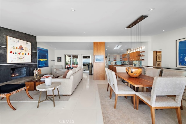 tiled dining area featuring a tile fireplace