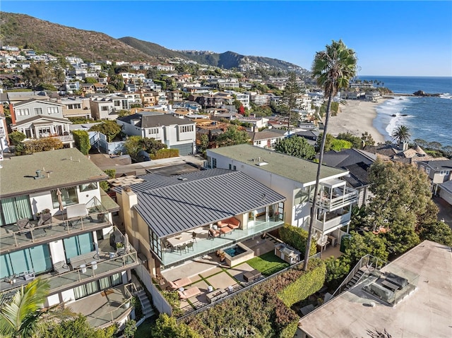 birds eye view of property with a water and mountain view