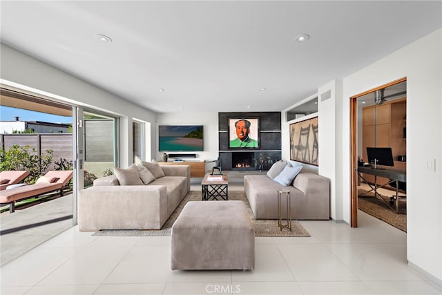 tiled living room with a fireplace