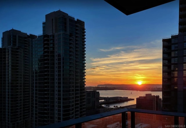 balcony at dusk with a water view