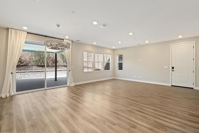 unfurnished living room with light wood-type flooring