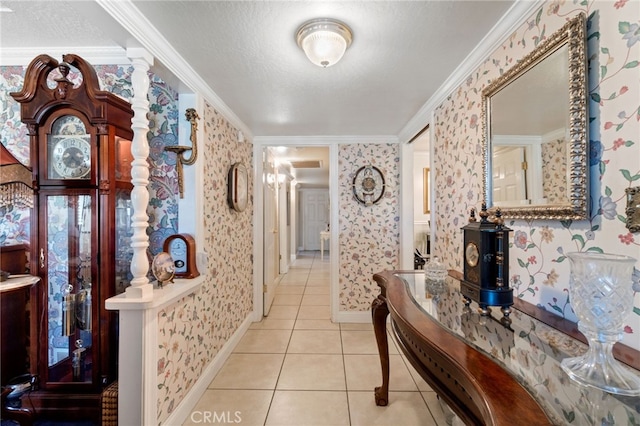 hallway featuring a textured ceiling, ornamental molding, and light tile patterned flooring