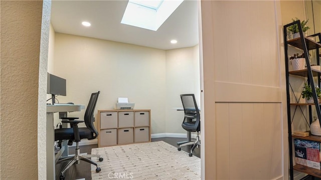 office space featuring a skylight