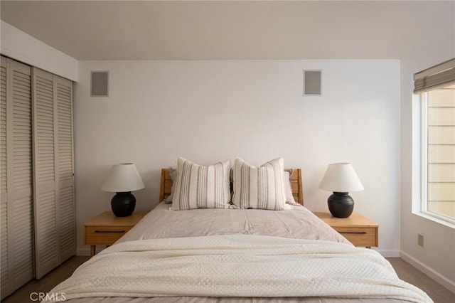 bedroom featuring a closet and hardwood / wood-style floors