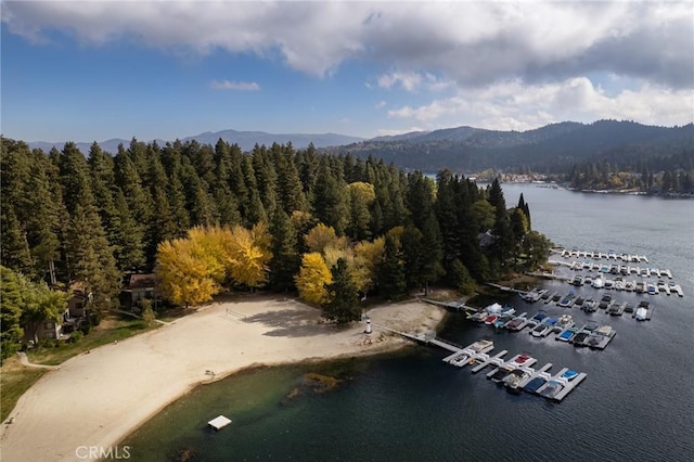 aerial view featuring a water and mountain view