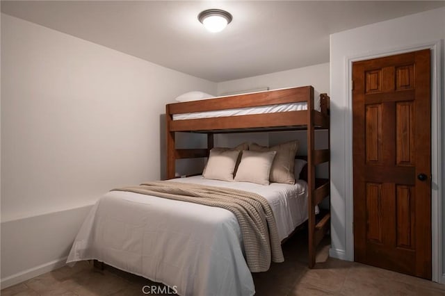 bedroom featuring tile patterned flooring