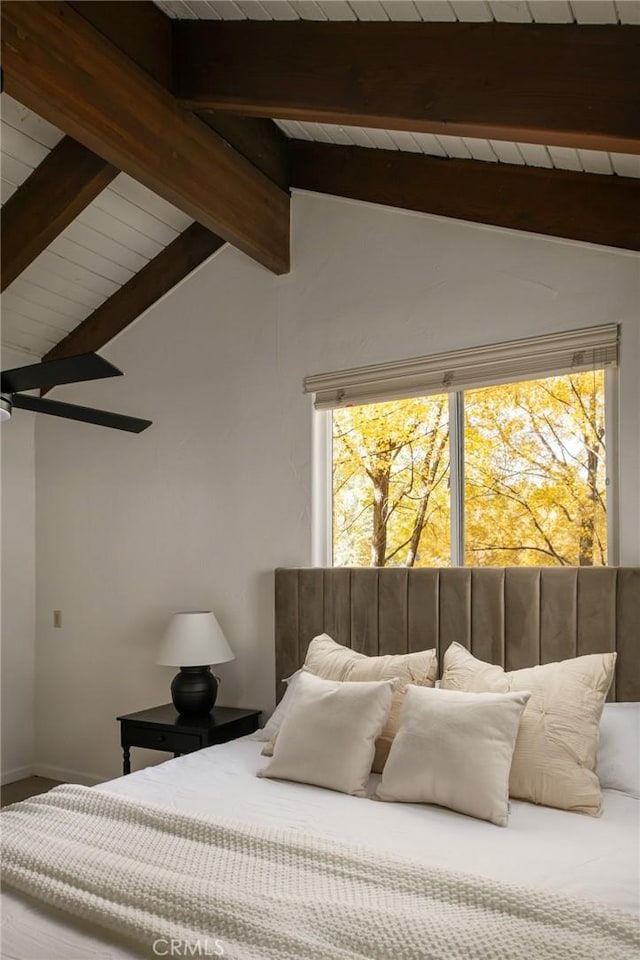 bedroom with lofted ceiling with beams, multiple windows, and ceiling fan