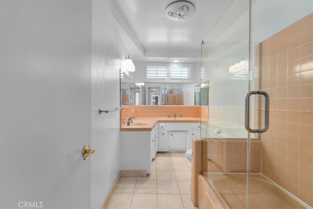 bathroom with vanity, an enclosed shower, toilet, tile patterned floors, and decorative backsplash