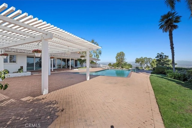 view of swimming pool with a pergola and a patio