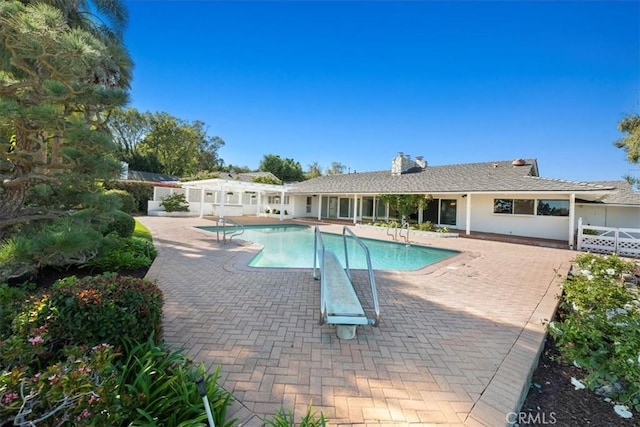 view of swimming pool with a patio area