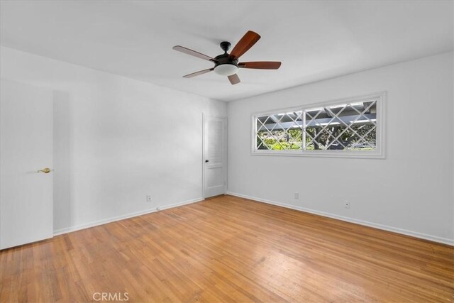 unfurnished room featuring ceiling fan and light hardwood / wood-style flooring