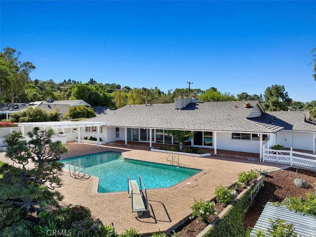 view of swimming pool with a patio area