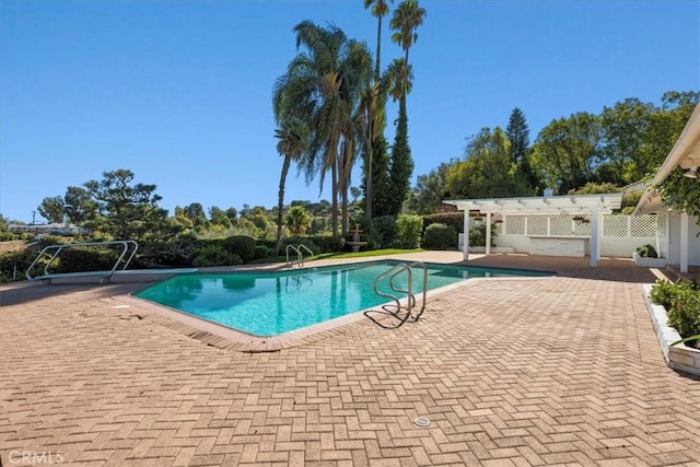 view of swimming pool featuring a patio and a pergola