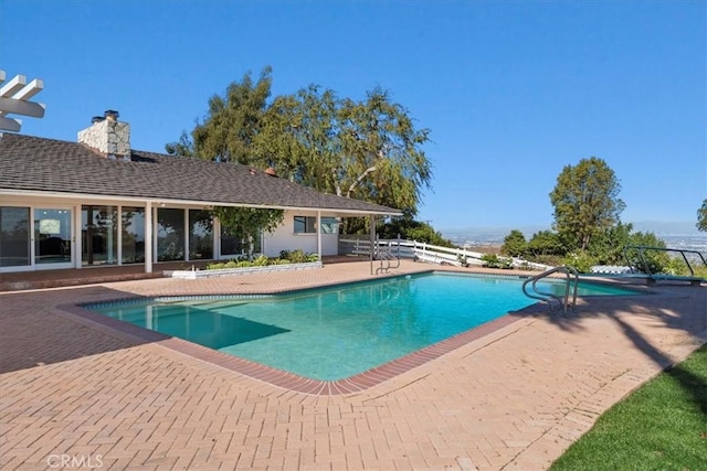 view of swimming pool featuring a patio