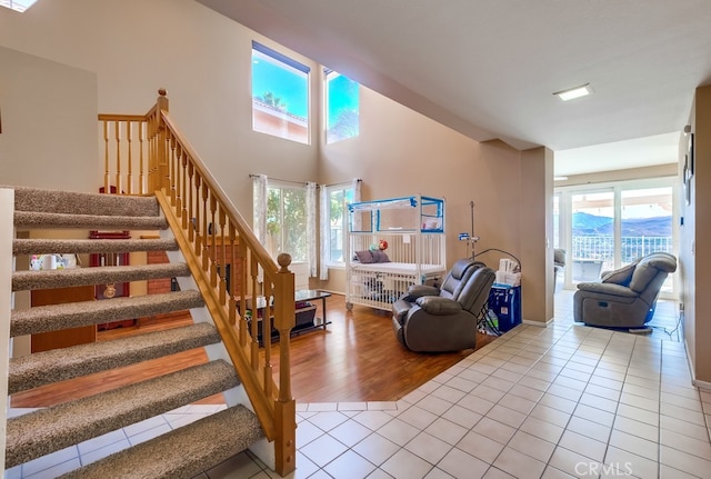 stairway with a mountain view and tile patterned floors