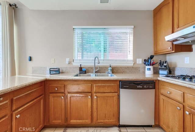 kitchen with white gas stovetop, dishwasher, sink, and light tile patterned flooring