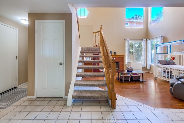 staircase featuring tile patterned flooring