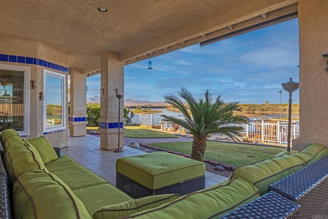 view of patio / terrace featuring outdoor lounge area and a water view