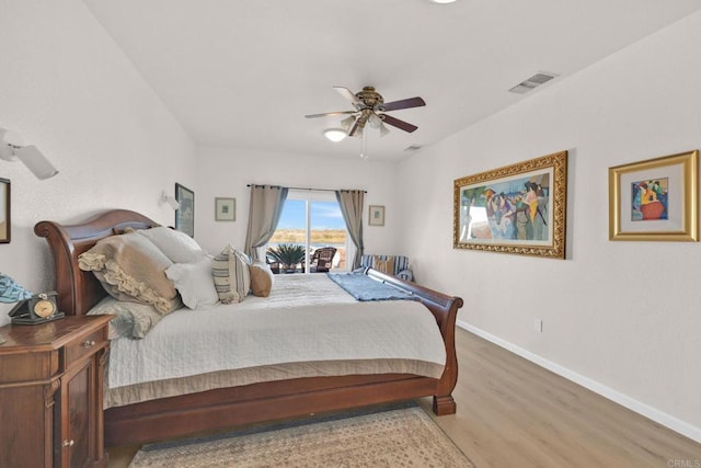 bedroom featuring access to outside, ceiling fan, and wood-type flooring