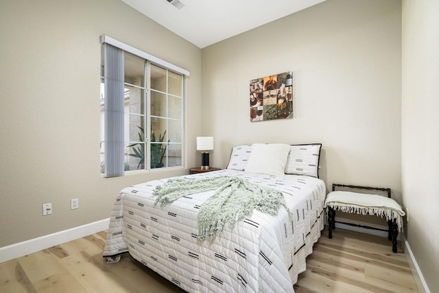 bedroom with light hardwood / wood-style floors