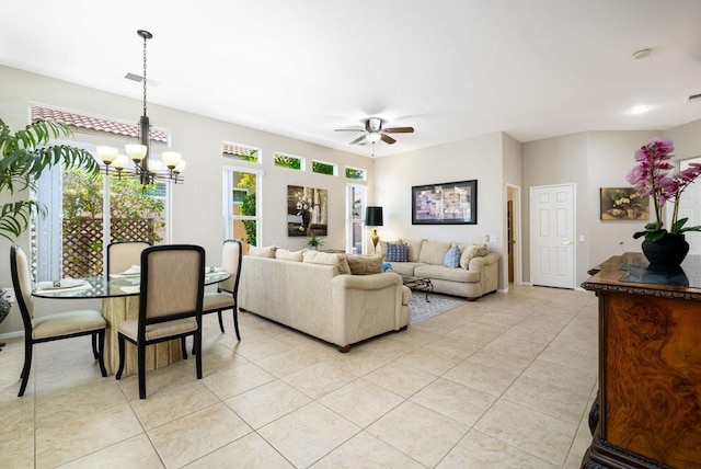 tiled living room featuring ceiling fan with notable chandelier