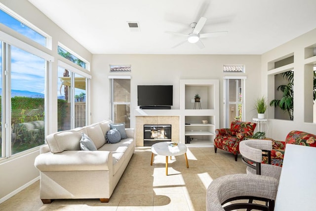 sunroom / solarium featuring ceiling fan and a healthy amount of sunlight