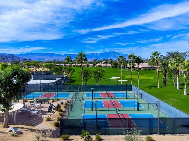 view of tennis court with a mountain view