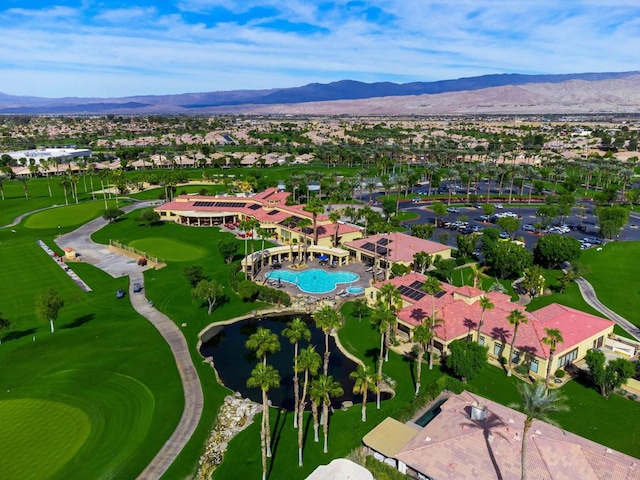 birds eye view of property with a mountain view